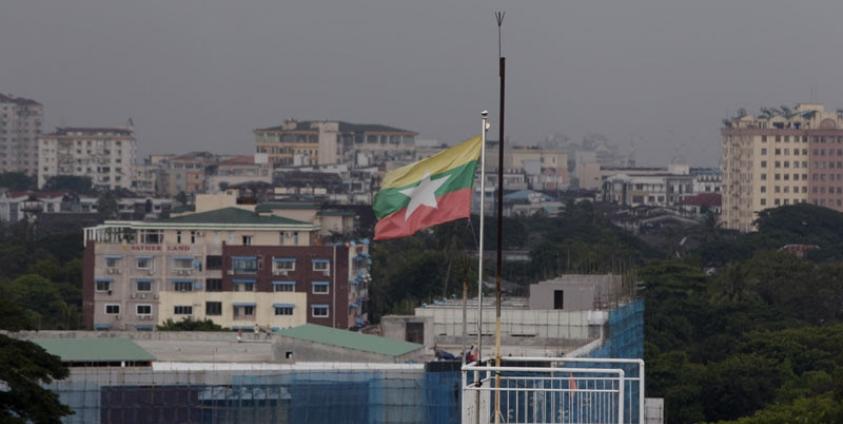 A general view of Yangon city with a Myanmar flag flying on a building in Yangon, Myanmar. Photo: Nyein Chan Naing/EPA