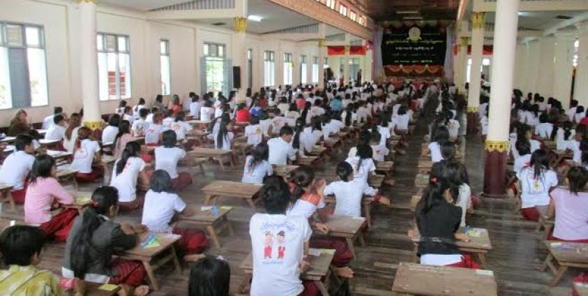 Students studying at a Mon literature summer class