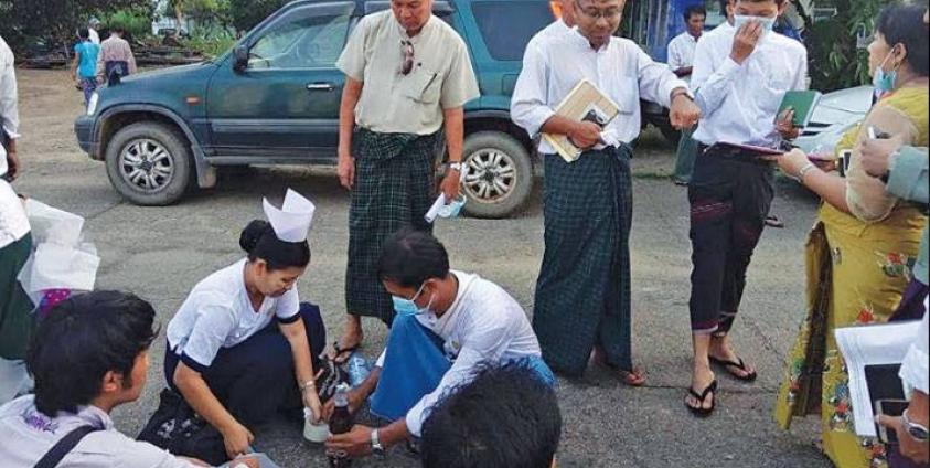 Checking water quality near Kanbe Lake (Photo: Facebook)