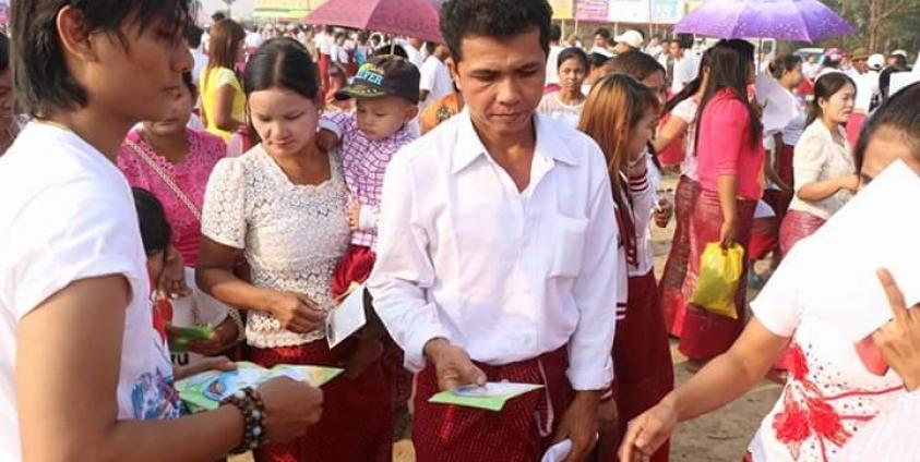 Free Mon literature learning CDs being given out.