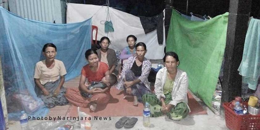 Sa Par Htar villagers rest at the Kha Maung Taw Monastery on June 12. The monastery is sheltering people who have come to Sittwe to seek testing and treatment for dengue.