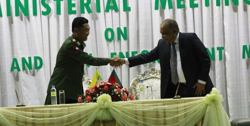 Minister of Home Affairs for the government of Bangladesh Asaduzzaman Khan (R), shakes hands with  Myanmar's Home Affairs Minister Lt.Gen Kyaw Swe (L), during a meeting on security and law enforcement matters, at Ministry of Home Affairs in Nay Pyi Taw on 24 October 2017. Photo: Min Min/Mizzima