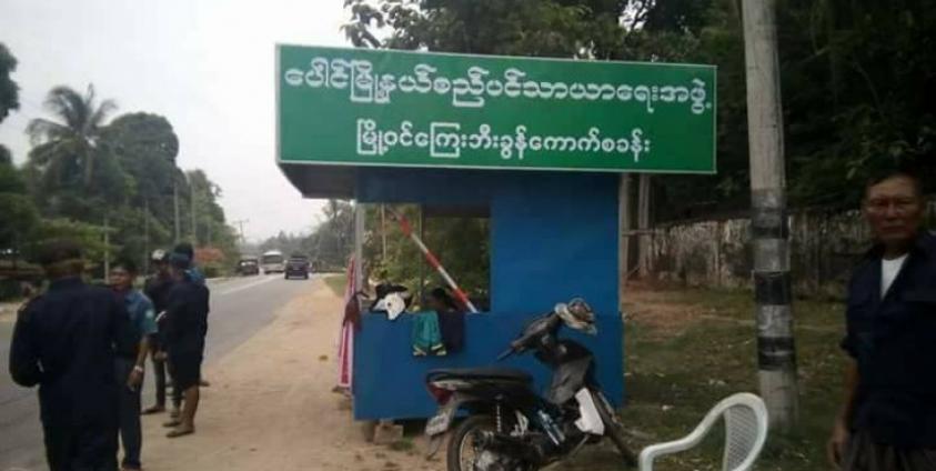 Drivers arrive at a wheel tax gate at the entrance of Paung. (Facebook)