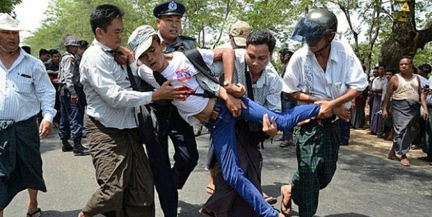 A Myanmar protester demanding labour rights is arrested by police in Tatkon township outside the capital Naypyidaw