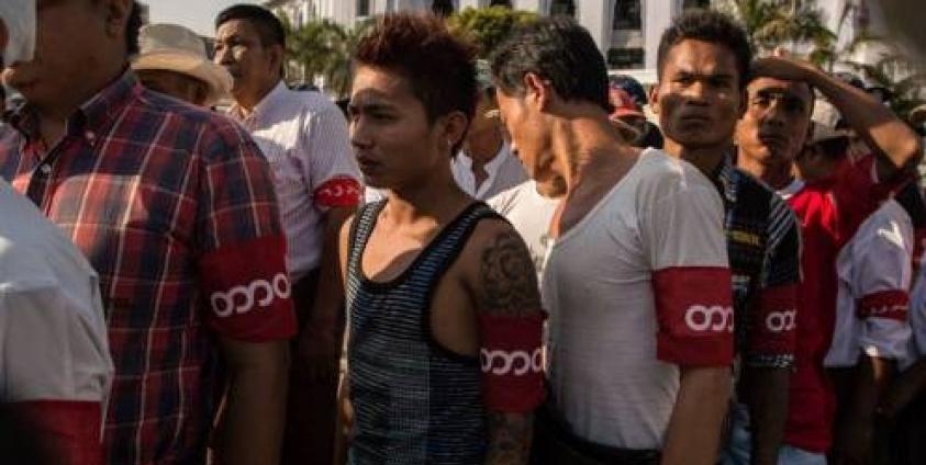 A group of Vigilantes Wearing Red Arm-Bands That Say 'Duty' in Burmese (Photo: The Irrawaddy)