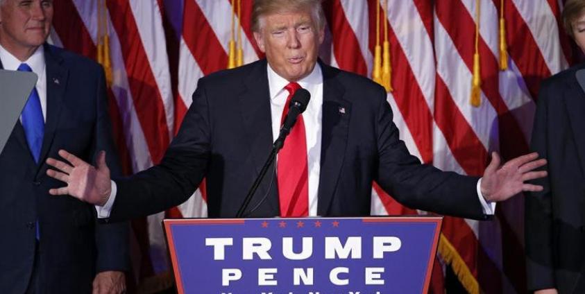 US Republican presidential nominee Donald Trump (C) delivers a speech on stage at Donald Trump's 2016 US presidential Election Night event as votes continue to be counted at the New York Hilton Midtown in New York, New York, USA, 08 November 2016. Photo: Shawn Thew/EPA