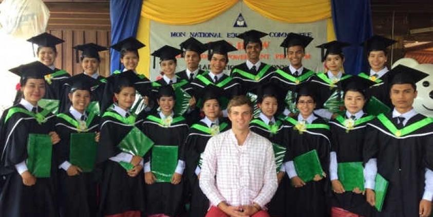 Bop Htaw graduates in group photo with their teacher at graduation ceremony (Photo: Bop Htaw)