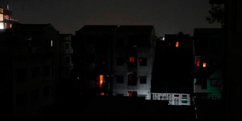 A view of buildings during a power outage at a residential area of Yangon, Myanmar, 14 January 2022. Photo: EPA