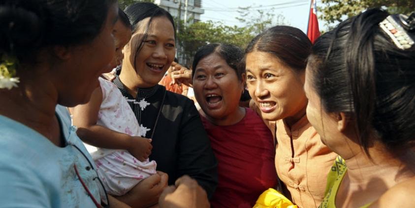 Political activist Naw Ohn Hla (C) is reunited with her friends after her release from Insein prison in Yangon, Myanmar, 17 April 2016. Photo: Nyein Chan Naing/EPA