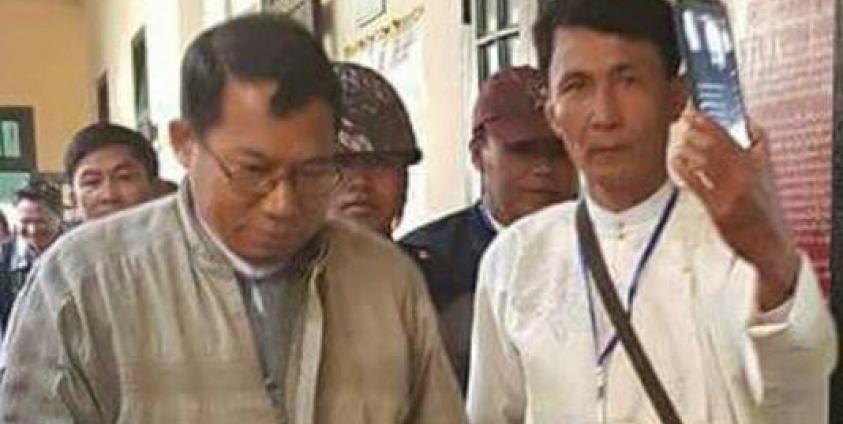 U Aung Than Wai, in white shirt, was walking by Dr. Aye Maung 