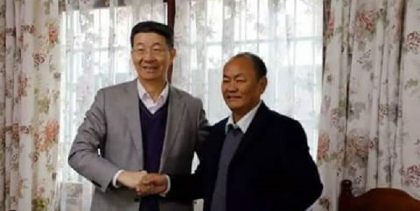 China’s special representative for Burma, Sun Gunxiang (left) and Bao Youxiang, the leader of the United Wa State Army (UWSA) (right).