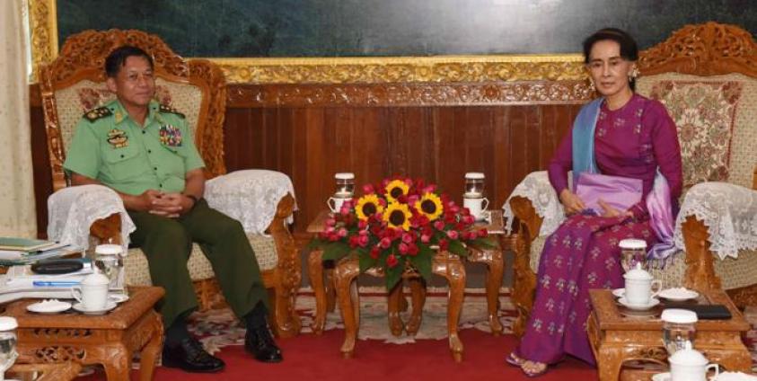 This handout photo released by Myanmar's State Counsellor's Office on August 9, 2016 and taken on August 8 shows Myanmar State Counsellor and Foreign Minister Aung San Suu Kyi (R) and military chief, Senior General Min Aung Hlaing (L), meeting in Naypyidaw. Photo: AFP
