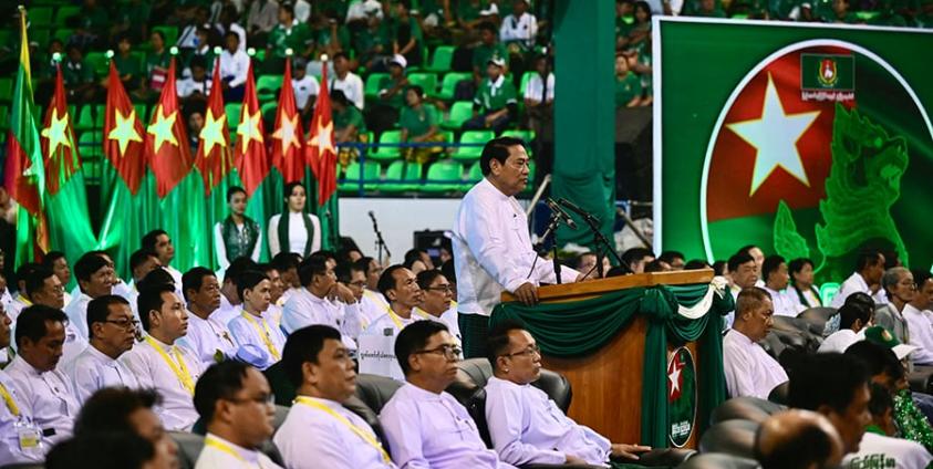 Chairman of the Myanmar military-backed Union Solidarity and Development Party (USDP) Khin Yi speaks during an election campaign event in Yangon on November 19, 2025. Myanmar junta has touted polls starting December 28 as a path to peace, but the vote will be blocked from rebel-held enclaves and monitors are dismissing it as a ploy to disguise continuing military rule. (Photo by Sai Aung MAIN / AFP) 