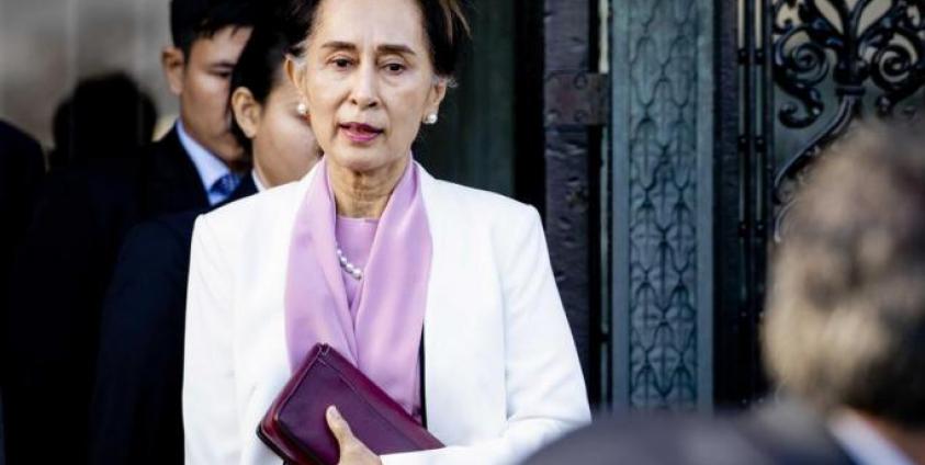 © AFP Myanmar State Counselor Aung San Suu Kyi (C) departs on the last day of the genocide case against Myanmar at the Peace Palace in The Hague, The Netherlands, 12 December 2019. Photo: EPA