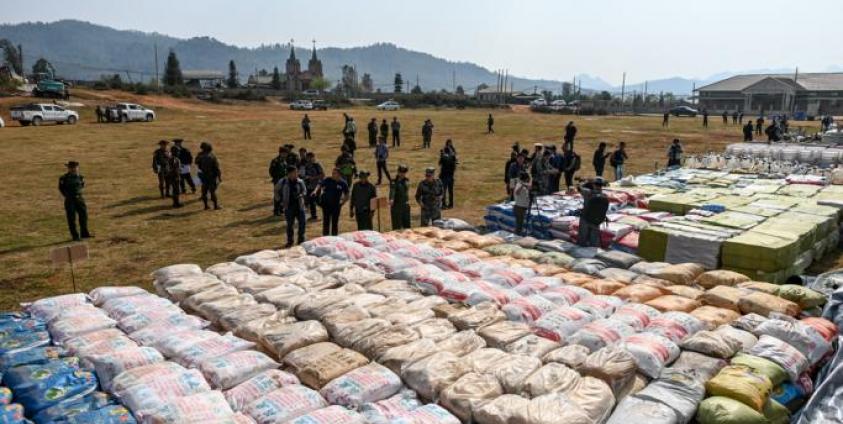 (File) Foreign military attaches check drugs in a football ground where seized drugs, vehicles, laboratory accessories and precursor chemicals are being displayed to be witnessed by invited military attaches and journalists in Kawnghka at Shan State on March 6, 2020. Photo: Ye Aung Thu/AFP