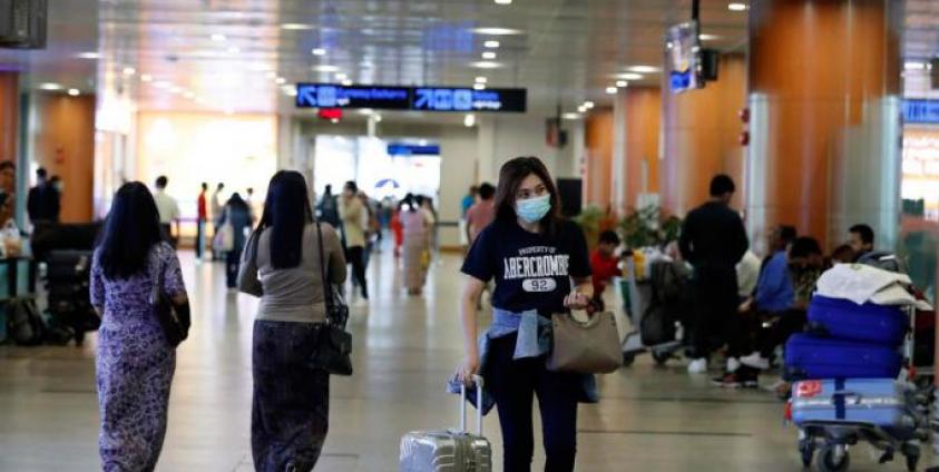 People wear masks at the arrival lounge at the Yangon International Airport in Yangon, Myanmar. Photo: Nyein Chan Naing/EPA