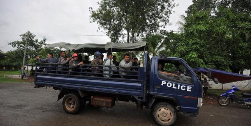 Policemen patrol in a truck the streets of Sittwe, capital of Myanmar's western state of Rakhine. Photo: AFP