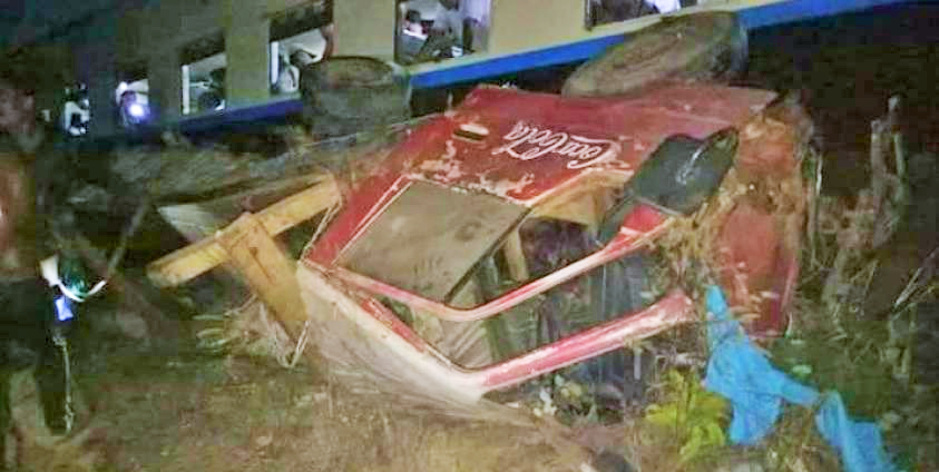 Crashed truck lied beside train track