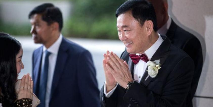 ၂၀၁၉ ခုနှစ်၊ မတ် ၂၂ ရက်က ဟောင်ကောင်ရှိ Rosewood Hong Kong ဟိုတယ်သို့ ထိုင်းနိုင်ငံရဲ့ ပြည်ပြေးဝန်ကြီးချုပ်ဟောင်း သက်ဆင်ရှင်နာဝတ်ထရာ ရောက်ရှိလာတာကို တွေ့မြင်ရစဉ်။ (ဓာတ်ပုံ - Jerome Favre/အီးပီအေ)