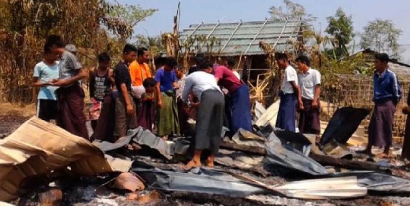 Locals survey the damage after fighting between Myanmar's military and ethnic Rakhine insurgents near the town of Mrauk U, former capital of the Rakhine kingdom. Photo: AFP