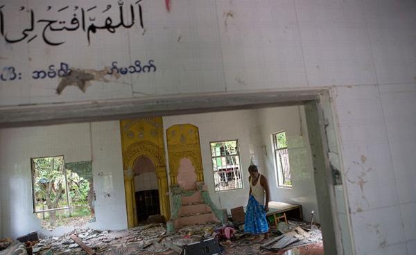 Ibrahim, 67, looks around inside the destroyed mosque at Thuye Tha Mein village of Waw township in Bago Province, Myanmar, 24 June 2016. Photo: Lynn Bo Bo/EPA