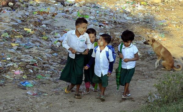 Myanmar children go to school near the bank of the Irrawaddy River in Mandalay, Myanmar. Photo: Hein Htet/EPA