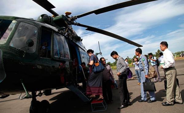 Renata Lok-Dessallien (left), United Nations Resident and Humanitarian Coordinator and UNDP Resident Representative in Myanmar, boards a military helicopter with diplomats on board to take off for a trip to Maungdaw town's fighting area at the Sittwe airport in Sittwe, Rakhine State, western Myanmar, 3 November. Foreign diplomats led by Renata, visit Sittwe and Maungdaw conflict area on 02 November and 03 November 2016 for the Human Rights accusations to the Muslims. Photo: Nyunt Win/EPA