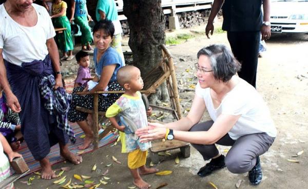 The UN is concerned about the continued displacement of people by fighting, among other concerns. UN Special Rapporteur Yanghee Lee, right, seen here on a recent visit to Zion Baptist IDP camp at Myitkyina Kachin State. Photo: UNIC Yangon