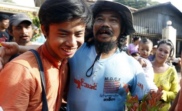 Htin Kyaw (R), director of the Movement for Democracy Current Force (MDCF), a community-based organisation working to promote development and democracy in Myanmar, is reunited with his friends after his release from Insein prison in Yangon, Myanmar, 17 April 2016. Photo: Nyein Chan Naing/EPA