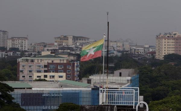 A general view of Yangon city with a Myanmar flag flying on a building in Yangon, Myanmar. Photo: Nyein Chan Naing/EPA