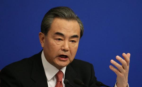 Chinese Foreign Minister Wang Yi gestures as he answers a question from a reporter during a press conference on the sidelines of the fourth session of the 12th National People's Congress (NPC) in Beijing, China, 08 March 2016. Photo: How Hwee Young/EPA