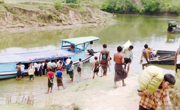 Aid Supplies being Unloaded from a Boat at Sapa Seik Village