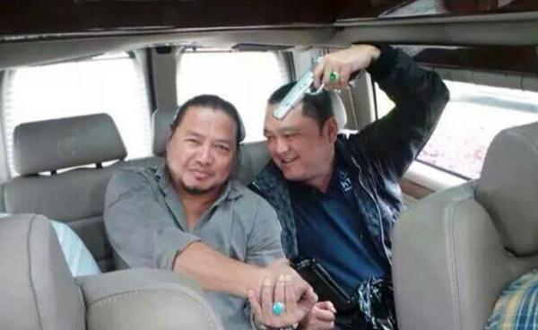 Tay Za (right) billionaire mountain climbing enthusiast and arms dealer