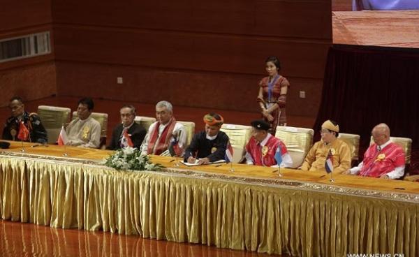 Leaders of eight ethnic armed organisations at the signing of the Nationwide Ceasefire Accord (NCA) in Naypyidaw on 15 October.