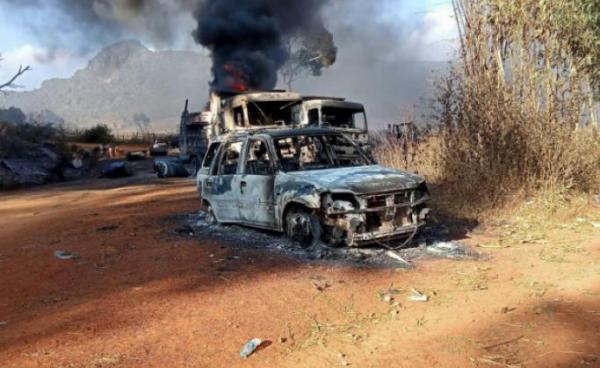 two burnt-out trucks and a car on a highway in Hpruso township (AFP/Handout)