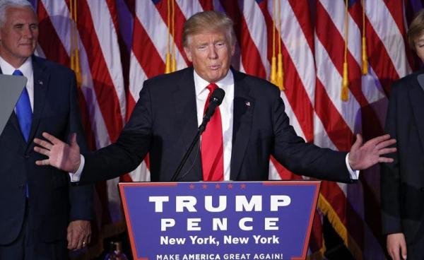 US Republican presidential nominee Donald Trump (C) delivers a speech on stage at Donald Trump's 2016 US presidential Election Night event as votes continue to be counted at the New York Hilton Midtown in New York, New York, USA, 08 November 2016. Photo: Shawn Thew/EPA