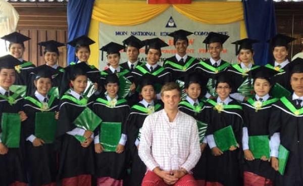 Bop Htaw graduates in group photo with their teacher at graduation ceremony (Photo: Bop Htaw) 