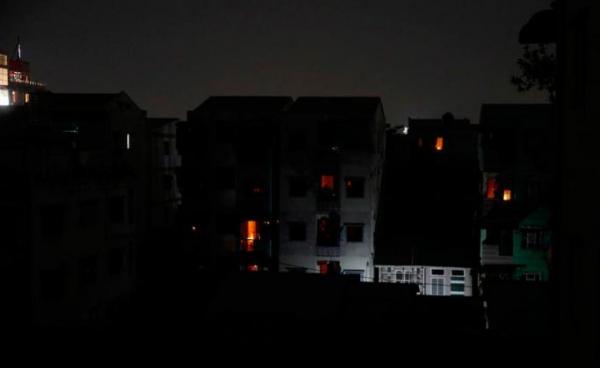  A view of buildings during a power outage at a residential area of Yangon, Myanmar, 14 January 2022. Photo: EPA