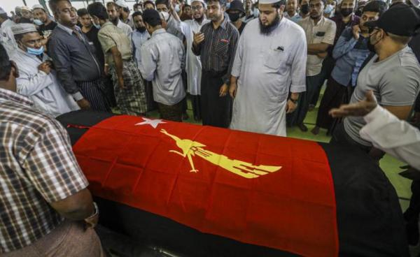 Relatives and friends of National League for Democracy member Khin Maung Latt, react during his funeral service in Muslim tradition held by the members of National League for Democracy (NLD) party in Yangon, Myanmar, 07 March 2021. Photo: EPA