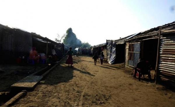 People walk around the Thet Kel Pyin internally displaced persons (IDP) camp in Sittwe, Rakhine State. Photo: EPA