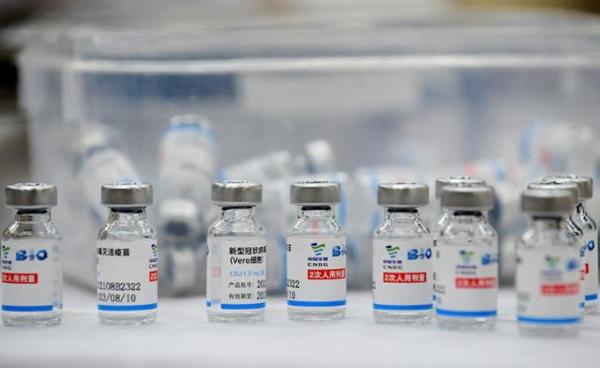 Empty vials of the Sinopharm Covid-19 coronavirus vaccine are kept on a table at a vaccination centre in Hanoi on September 10, 2021. Nhac NGUYEN / AFP