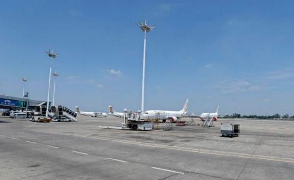 Myanmar National Airlines (MNA) aircraft parked on the tarmac as commercial flights remain temporarily suspended as part of the measures to control the spread of the COVID-19 coronavirus disease, at Yangon International Airport in Yangon, Myanmar, 10 May 2020. Photo: EPA