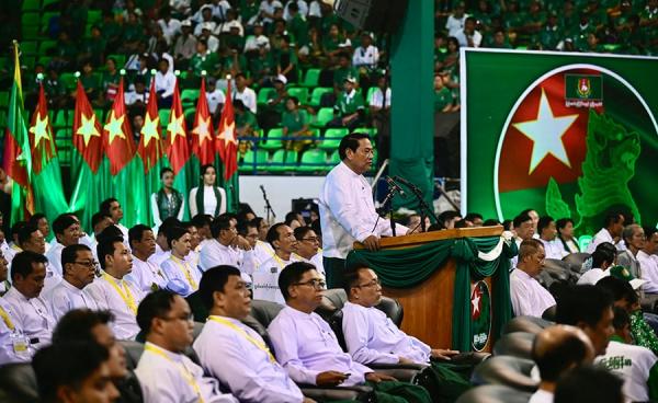 Chairman of the Myanmar military-backed Union Solidarity and Development Party (USDP) Khin Yi speaks during an election campaign event in Yangon on November 19, 2025. Myanmar junta has touted polls starting December 28 as a path to peace, but the vote will be blocked from rebel-held enclaves and monitors are dismissing it as a ploy to disguise continuing military rule. (Photo by Sai Aung MAIN / AFP) 