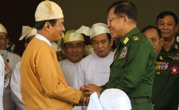 Myanmar's new president Win Myint, seen here with Myanmar Military chief Min Aung Hlaing, right, promised to look at the country's military-written constitution, corruption and human rights in his inaugural speech. Photo: Min Min for Mizzima