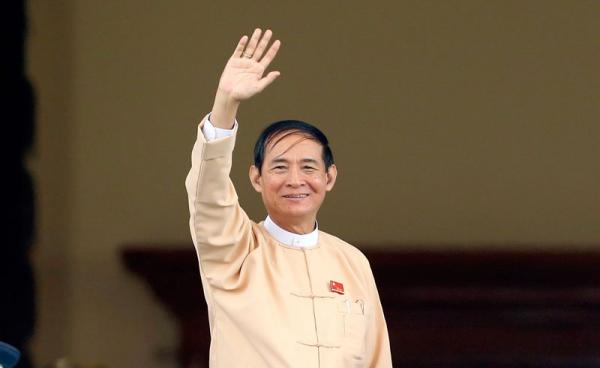 Newly elected president Win Myint and member of the National League for Democracy (NLD) party waves after the voting ceremony at Union parliament session in Naypyitaw, Myanmar, 28 March 208. Photo: Hein Htet/EPA-EFE