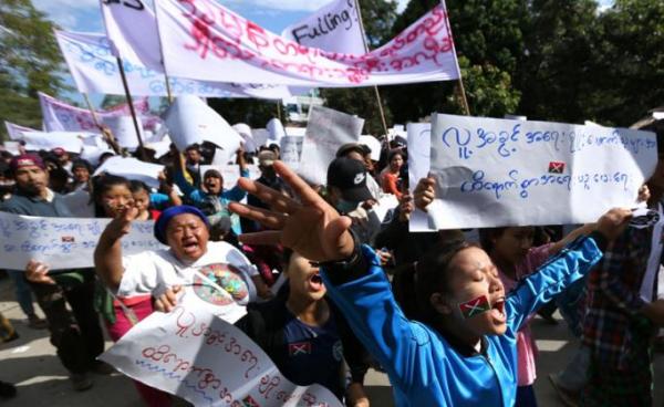 Demonstrators march in support of three local activists jailed by authorities during a rally in Myitkyina, capital of restive Kachin state on December 11, 2018. Photo: Zau Ring Hpra/AFP