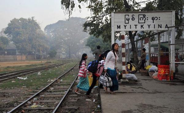 Myanmar women walk on a platform at the train station in Myitkyina, northern Kachin state, Myanmar. Photo: AFP