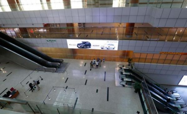 People stand in the departure lounge at the Yangon International Airport in Yangon, Myanmar, Myanmar, 18 March 2020. Photo: EPA