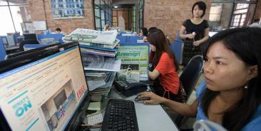 Journalists at work in the news room of of Myanmar Times weekly journal, Yangon, Myanmar. Photo: Lynn Bo Bo/EPA